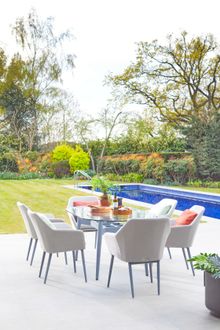 Photo 6 | Bridgman Casual Dining Collection | 180cm Henley Glass and Aluminium Dining Table with 6 Richmond Armchairs  | £2,999