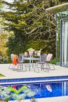 Photo 9 | Bridgman Casual Dining Collection | 180cm Henley Glass and Aluminium Dining Table with 6 Remy Stacking Armchairs | £1,599