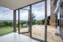 Bifolding doors to Waterfalls contemporary extension merges the outside with the inside.
