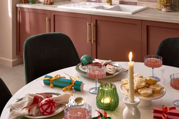 Colourful festive dining table set with plates, glasses, and napkins. Colourful festive dining table set with plates, glasses, and napkins.