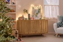 Wooden cabinet with an arched design.