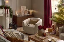 Plush armchair with a cosy, textured design.