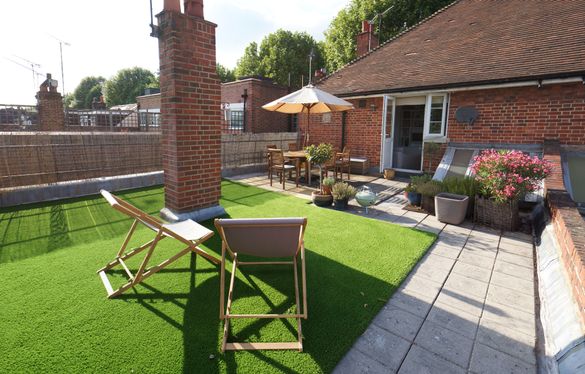 After – The same terrace, now resurfaced with LazyLawn. 