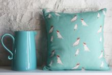 Cushion in Kate Medlicott Kooky Cockatoos Turquoise and Berry