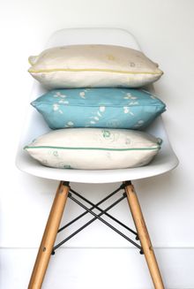 Kate Medlicott Cushions in Pile of Cushions in Faded Flora in Lemon Posset, Eucalyptus & Julio in Aqua, Faded Flora in Apple and Stone