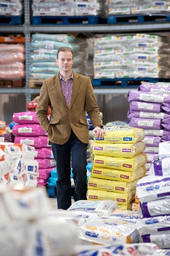 Iain Booth with pet food bags 
