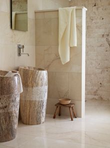 'Cosmo' basins, available in various stone shades, the wild and wonderful 'Picasso' travertine is shown here and costs £834 each